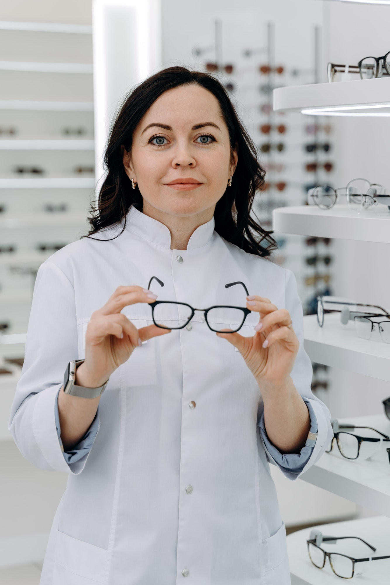 handsome-ophthalmologist-holding-eyeglasses-for-a-try-out-.jpg