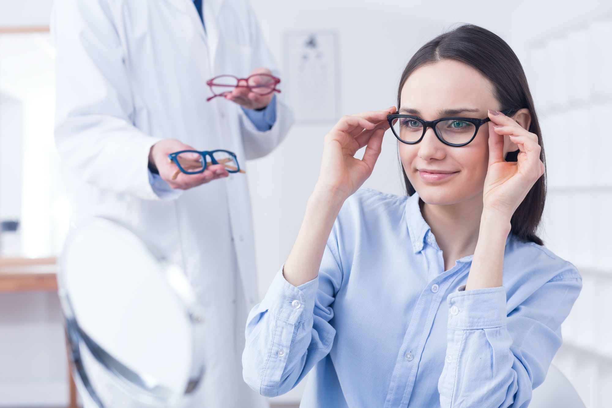 optician-with-eyeglasses-and-client.jpg