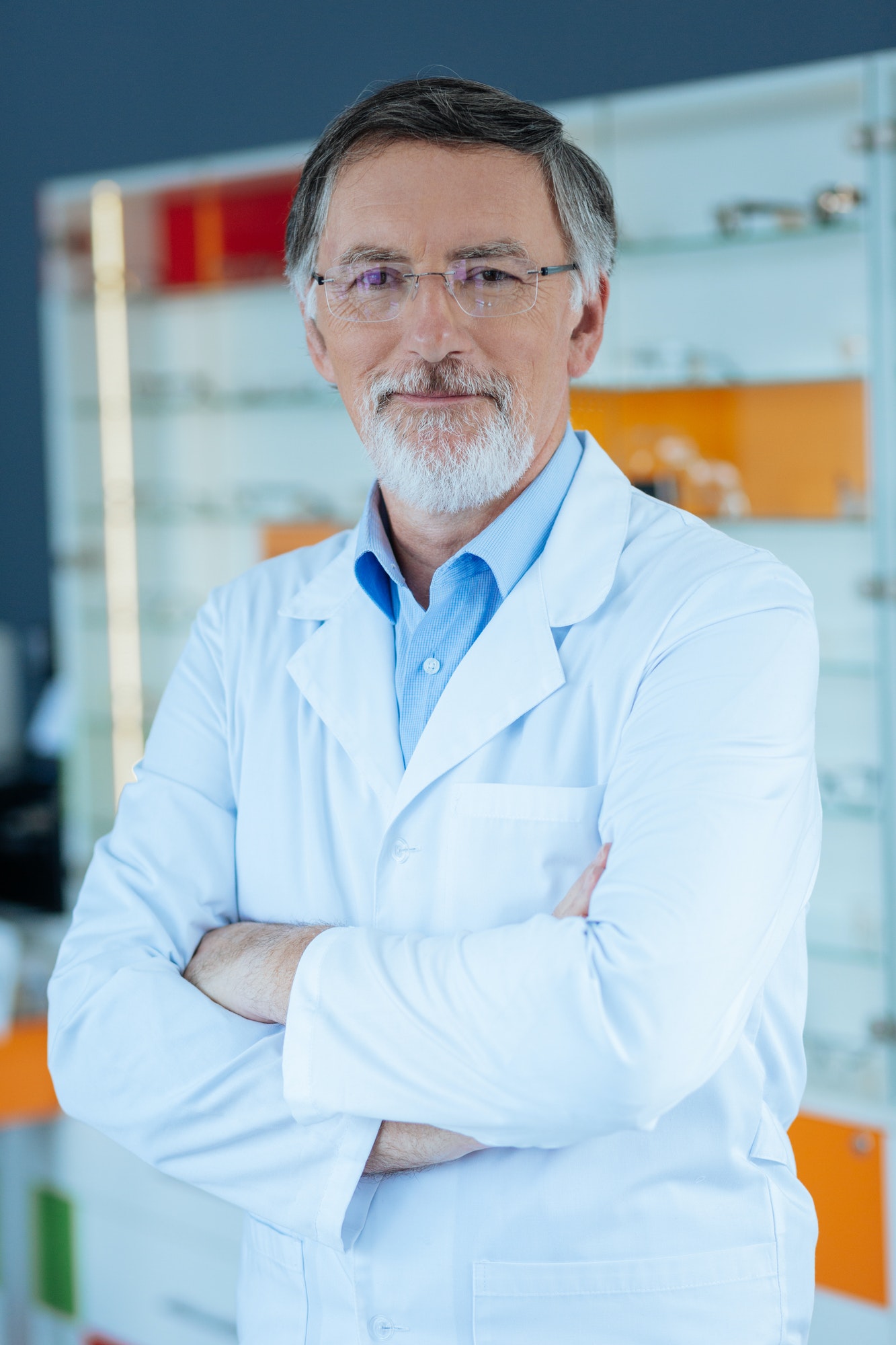 positive-nice-professional-optician-standing-cross-handed.jpg